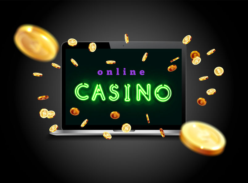 The blue neon word Casino Coins are falling from the laptop The big jackpot You are the winner